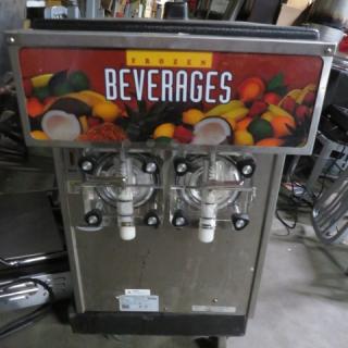 One Crathco Grindmaster Twin Barrel Frozen Drink Machine. Model# CFB3312-A. 115 Volt. 18.5X29X28