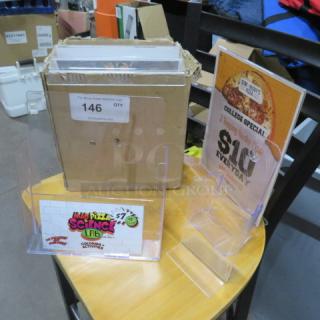 One Lot Of Assorted Poly Table Tents And Holders.