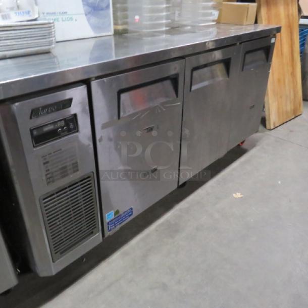One Turbo Air 3 Door Worktop Refrigerator With 3 Racks On Casters. Model# JUR-72N. 115 Volt. 71X24X34 - Image 1 of 2