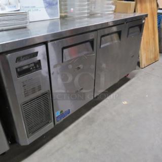 One Turbo Air 3 Door Worktop Refrigerator With 3 Racks On Casters. Model# JUR-72N. 115 Volt. 71X24X34