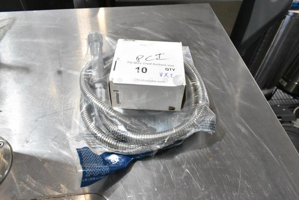 2 BRAND NEW SCRATCH AND DENT! Items Including T&S B-0068-H 68" Stainless Steel Flex Hose with Gray Handle and Polyurethane Liner and 600DB35 Regency 3 1/2" Basket Drain with Strainer - 1 1/2" IPS. 2 Times Your Bid! - Image 1 of 5