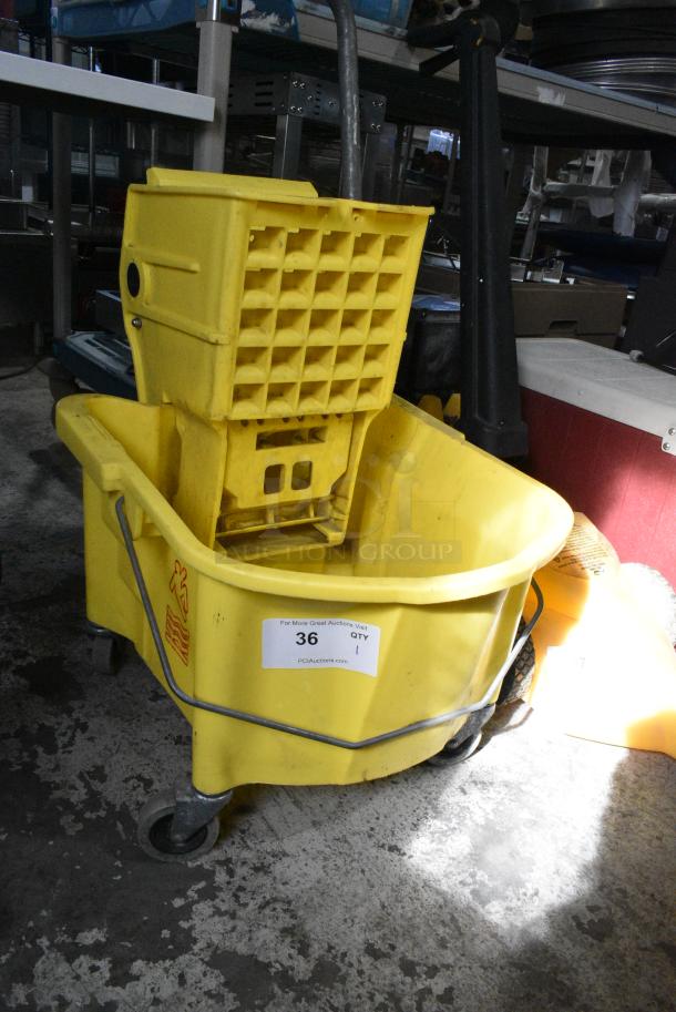 Yellow Poly Mop Bucket w/ Wringing Attachment on Commercial Casters. - Image 1 of 8