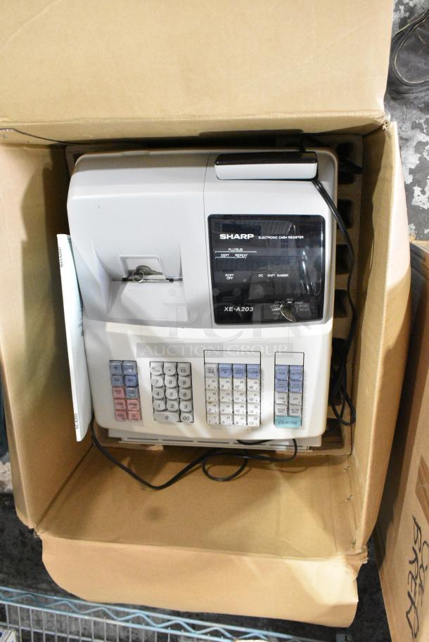 IN ORIGINAL BOX! Sharp XE-A203 Countertop Electronic Cash Register. 115 Volts, 1 Phase. - Image 1 of 3