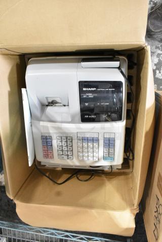 IN ORIGINAL BOX! Sharp XE-A203 Countertop Electronic Cash Register. 115 Volts, 1 Phase.