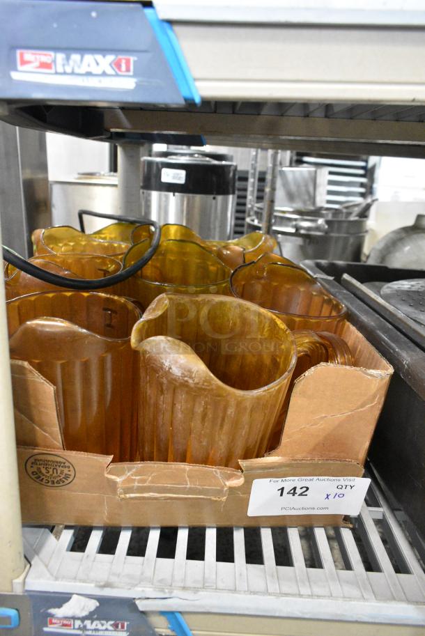 ALL ONE MONEY! Lot of 10 Poly Amber Colored Pitchers. - Image 1 of 5