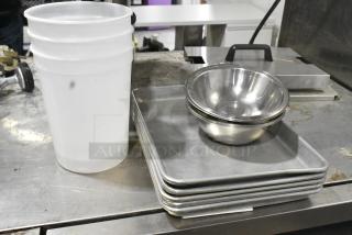 13 Various Items Including Metal Baking Pans, Metal Bowls and Poly Bins. 13 Times Your Bid!