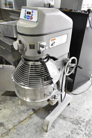 Globe SP60 Metal Commercial Floor Style 60 Quart Planetary Dough Mixer w/ Stainless Steel Mixing Bowl, Bowl Guard and Dough Hook Attachment. 220 Volts, 1 Phase.