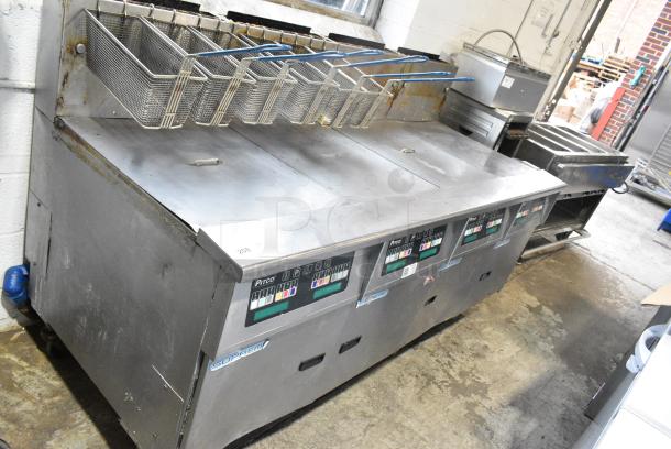 Pitco Frialator SSH60W Stainless Steel Commercial Natural Gas Powered 4 Bay Deep Fat Fryer w 6 Metal Fry Baskets on Commercial Casters.  100,000 BTU. - Image 1 of 16