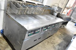 Pitco Frialator SSH60W Stainless Steel Commercial Natural Gas Powered 4 Bay Deep Fat Fryer w 6 Metal Fry Baskets on Commercial Casters.  100,000 BTU.