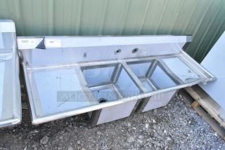 BRAND NEW SCRATCH AND DENT! Regency 600S21717218 72" 16-Gauge Stainless Steel Two Compartment Commercial Sink with Galvanized Steel Legs and 2 Drainboards - 17" x 17" x 12" Bowls.  No Legs.