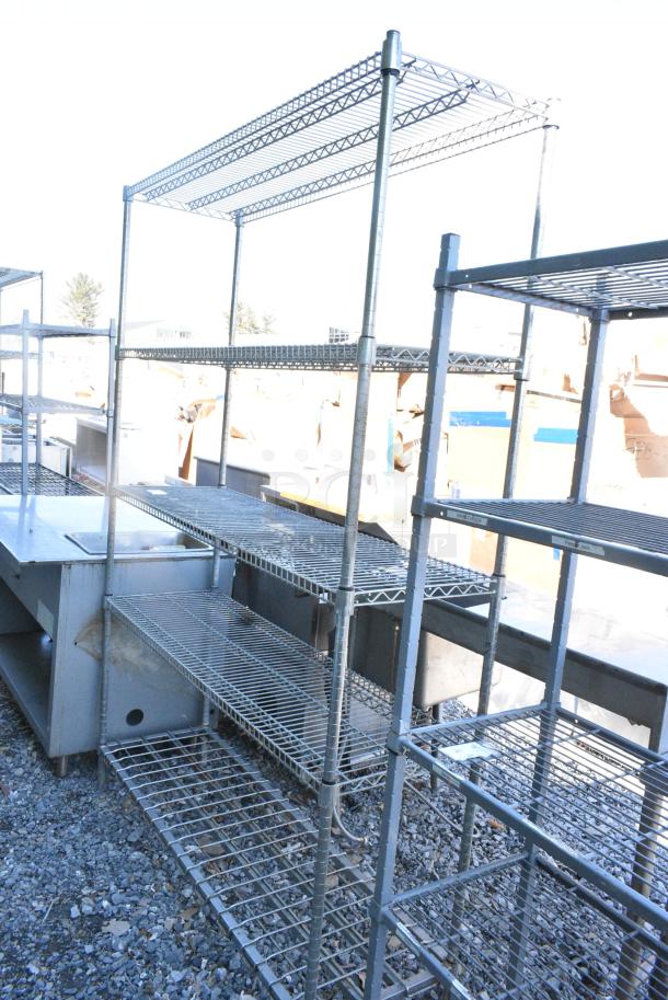 Chrome Finish Metal 5 Tier Shelving Unit. BUYER MUST DISMANTLE. PCI CANNOT DISMANTLE FOR SHIPPING. PLEASE CONSIDER FREIGHT CHARGES. - Image 1 of 5