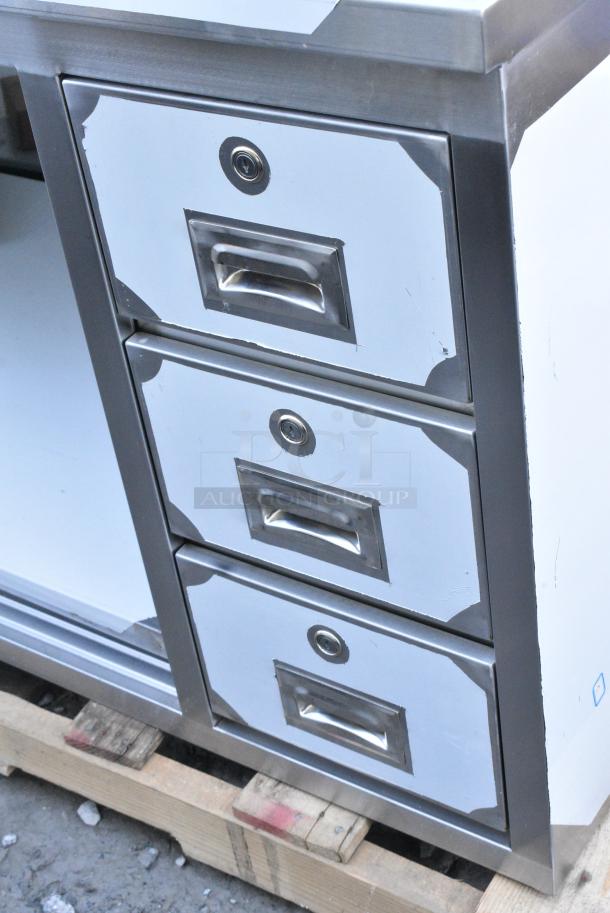 BRAND NEW SCRATCH AND DENT! Regency 600EBT3072R 30" x 72" 16 Gauge Type 304 Stainless Steel Enclosed Base Sliding Door Table with Drawers - Image 3 of 6