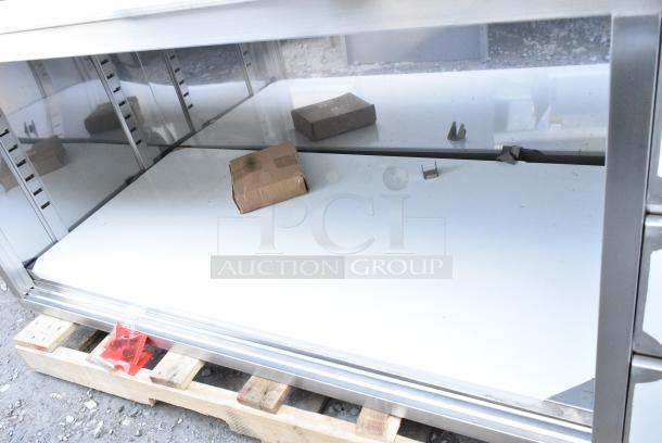 BRAND NEW SCRATCH AND DENT! Regency 600EBT3072R 30" x 72" 16 Gauge Type 304 Stainless Steel Enclosed Base Sliding Door Table with Drawers - Image 5 of 6
