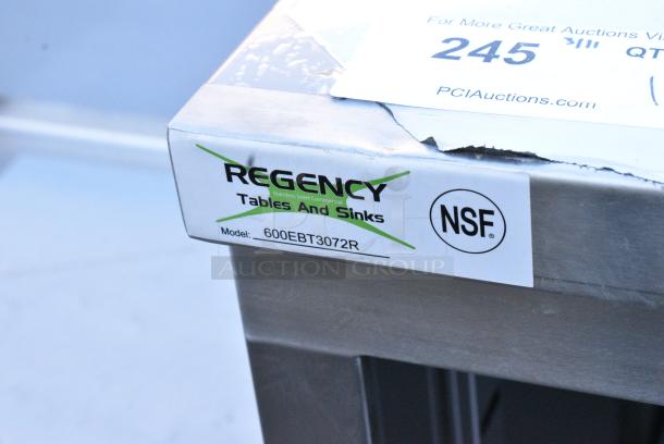 BRAND NEW SCRATCH AND DENT! Regency 600EBT3072R 30" x 72" 16 Gauge Type 304 Stainless Steel Enclosed Base Sliding Door Table with Drawers - Image 6 of 6