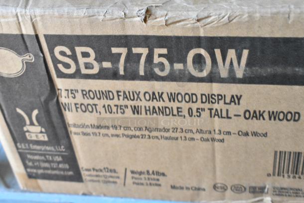 BRAND NEW SCRATCH AND DENT! Box of 12 GET SB-775-OW Madison Avenue / Granville 10 3/4" Round Faux Oak Wood Melamine Display Board with Foot and Handle - Image 3 of 4