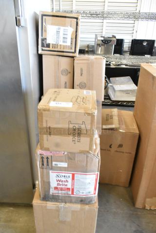 12 BRAND NEW SCRATCH AND DENT! Items Including Noble Wash Brite, 2 Box Exam Table Paper, 2 Box Chicago Bakeware. 12 Times Your Bid!