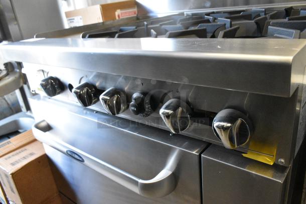 BRAND NEW! Cookrite ATO-12G4B Stainless Steel Commercial Propane Gas Powered 4 Burner Range w/ Left Side Flat Top Griddle, Oven and Salamander Cheese Melter on Commercial Casters. - Image 6 of 15