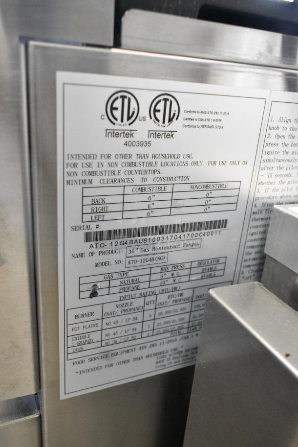 BRAND NEW! Cookrite ATO-12G4B Stainless Steel Commercial Propane Gas Powered 4 Burner Range w/ Left Side Flat Top Griddle, Oven and Salamander Cheese Melter on Commercial Casters. - Image 10 of 15