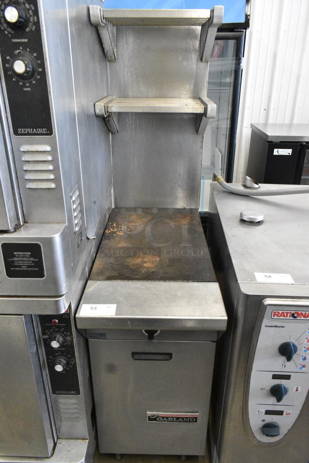 Garland M6S Stainless Steel Commercial Natural Gas Powered Flat Top Griddle w/ 2 Tier Over Shelf on Commercial Casters. - Image 1 of 7