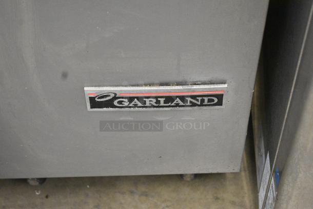 Garland M6S Stainless Steel Commercial Natural Gas Powered Flat Top Griddle w/ 2 Tier Over Shelf on Commercial Casters. - Image 2 of 7