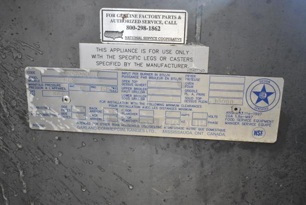 Garland M6S Stainless Steel Commercial Natural Gas Powered Flat Top Griddle w/ 2 Tier Over Shelf on Commercial Casters. - Image 7 of 7
