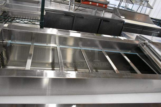 BRAND NEW SCRATCH AND DENT! 2024 Avantco 178SSPPT3 Stainless Steel Commercial 94" 3 Door Refrigerated Pizza Prep Table w/ 4 Drawers and 1 Door on Commercial Casters. 115 Volts, 1 Phase. Tested and Working! - Image 3 of 14