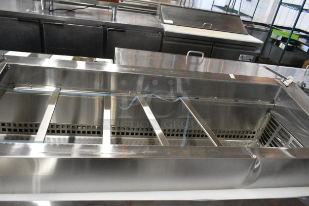 BRAND NEW SCRATCH AND DENT! 2024 Avantco 178SSPPT3 Stainless Steel Commercial 94" 3 Door Refrigerated Pizza Prep Table w/ 4 Drawers and 1 Door on Commercial Casters. 115 Volts, 1 Phase. Tested and Working! - Image 6 of 14