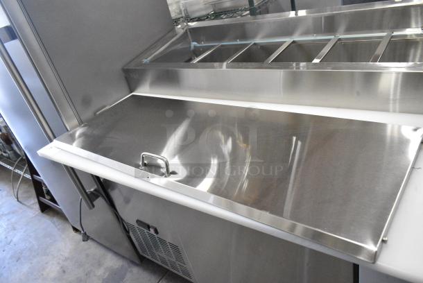 BRAND NEW SCRATCH AND DENT! 2024 Avantco 178SSPPT3 Stainless Steel Commercial 94" 3 Door Refrigerated Pizza Prep Table w/ 4 Drawers and 1 Door on Commercial Casters. 115 Volts, 1 Phase. Tested and Working! - Image 8 of 14
