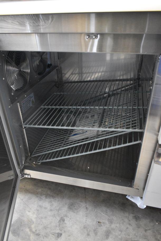 BRAND NEW SCRATCH AND DENT! 2024 Avantco 178SSPPT3 Stainless Steel Commercial 94" 3 Door Refrigerated Pizza Prep Table w/ 4 Drawers and 1 Door on Commercial Casters. 115 Volts, 1 Phase. Tested and Working! - Image 9 of 14