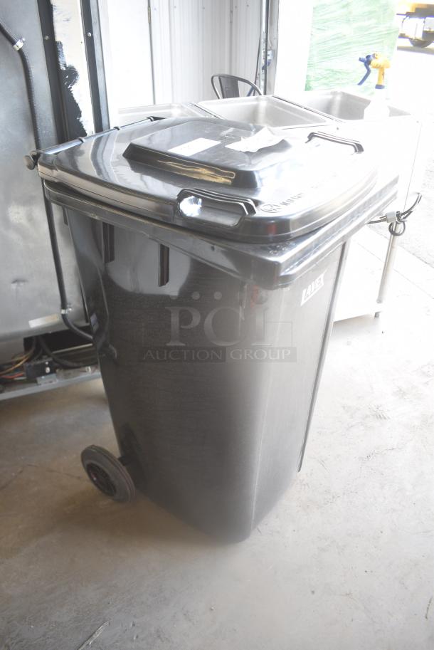 BRAND NEW SCRATCH AND DENT! Lavex 475TCWHL50BK 50 Gallon Black Wheeled Rectangular Trash Can with Lid - Image 4 of 7