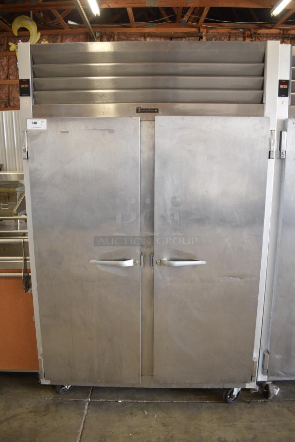 Traulsen G20010 Stainless Steel Commercial 2 Door Reach In Cooler w/ Poly Coated Racks on Commercial Casters. 115 Volts, 1 Phase. Tested and Powers On But Does Not Get Cold - Image 1 of 8