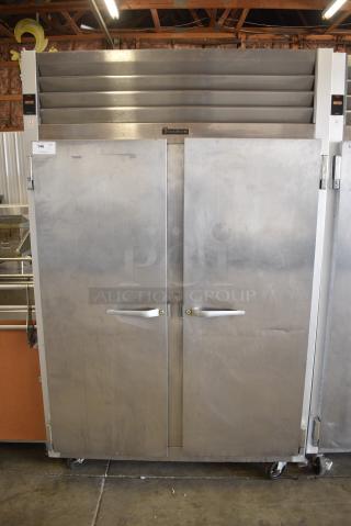 Traulsen G20010 Stainless Steel Commercial 2 Door Reach In Cooler w/ Poly Coated Racks on Commercial Casters. 115 Volts, 1 Phase. Tested and Powers On But Does Not Get Cold