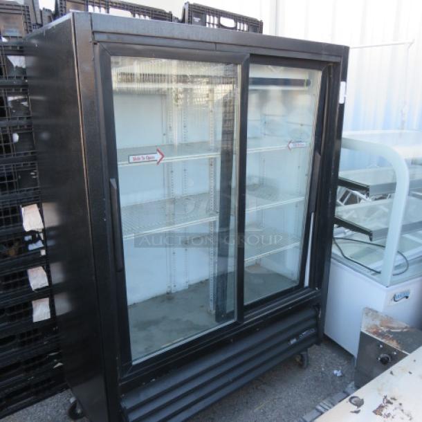 One WORKING True 2 Door Glass Display Cooler With 5 Racks On Casters. Model# GEM-41SL-60. 115 Volt. $5654.20. - Image 1 of 2