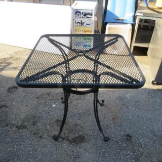 One Black Metal Patio Table With Umbrella Holder. 28X28X29