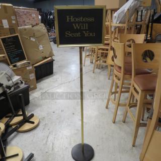 One HOSTESS WILL SEAT YOU Sign.