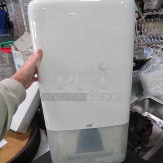 One NEW Tork Wall Mount Napkin Dispenser.
