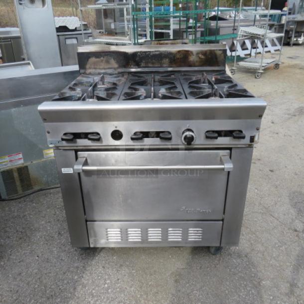 One WORKING  US Range Natural Gas 6 Burner/Convection Oven  Range With 2 Racks, On Casters. Model# PS-6-26RC. 36X32X43. $11,761.00. - Image 1 of 4