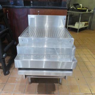 One Glastender Drain Table With 2 Tier Bottle Rail, Under Shelf, And Backsplash. 24X33X37