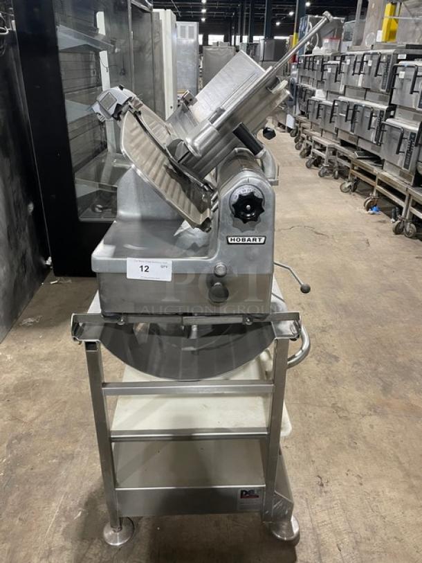 Hobart Commercial Heavy Duty Electric Powered Countertop Deli Meat Slicer! Model: 1712E SN: 56-932-680! 115V 1 Phase! On Face-To-Face Commercial Stainless Steel Double Shelf Equipment Cart/Stand! With Legs & Casters! - Image 1 of 9