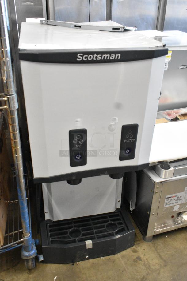 BRAND NEW SCRATCH AND DENT! 2024 Scotsman HID312AB-1A Stainless Steel Meridian Countertop Air Cooled Ice Machine and Water Dispenser with Push Button Dispensing - 12 lb. Bin Storage. 115 Volts, 1 Phase. - Image 1 of 6