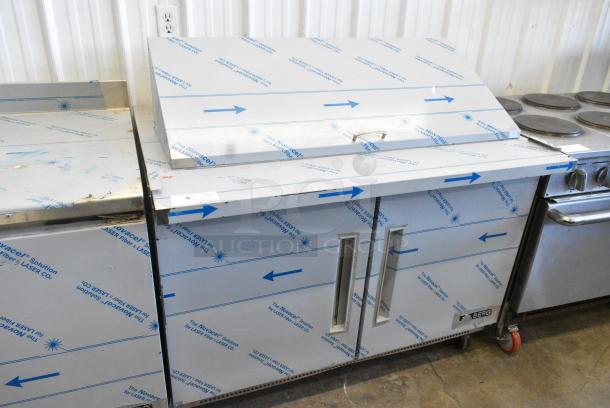 BRAND NEW SCRATCH AND DENT! 2021 Berg EDMT 48 18 BERG HC Stainless Steel Commercial Sandwich Salad Prep Table Bain Marie Mega Top on Commercial Casters 115 Volts, 1 Phase. Tested and Working! - Image 1 of 10