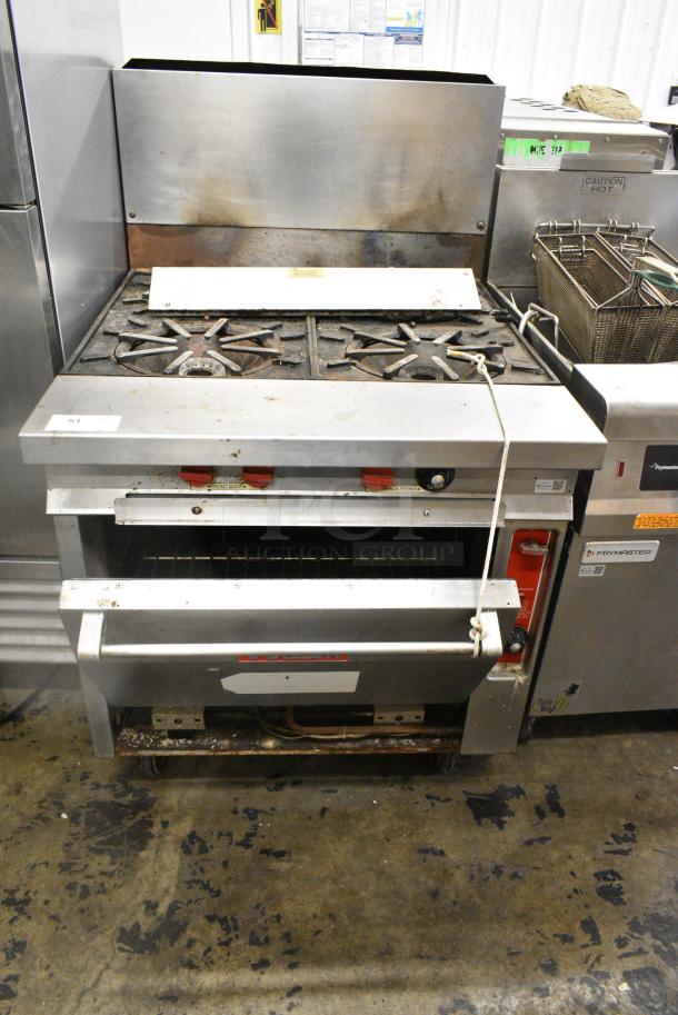 Vulcan Stainless Steel Commercial Natural Gas Powered 4 Burner Range w/ Oven and Back Splash on Commercial Casters. - Image 2 of 10
