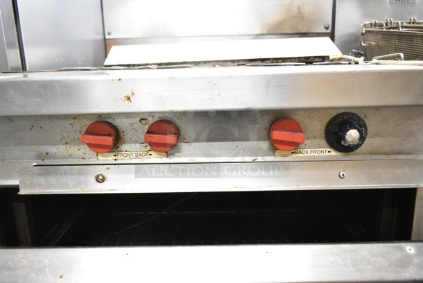 Vulcan Stainless Steel Commercial Natural Gas Powered 4 Burner Range w/ Oven and Back Splash on Commercial Casters. - Image 5 of 10