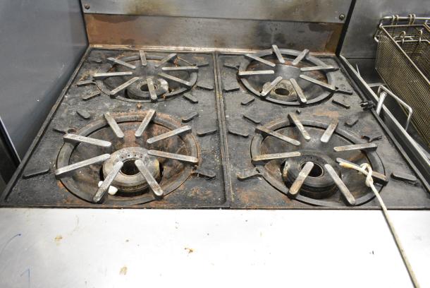 Vulcan Stainless Steel Commercial Natural Gas Powered 4 Burner Range w/ Oven and Back Splash on Commercial Casters. - Image 7 of 10