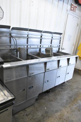 Pitco Frialator SGH50 Stainless Steel Commercial Floor Style Natural Gas Powered 5 Bay Deep Fat Fryer w/ Filtration System on Commercial Casters. 80,000 BTU.