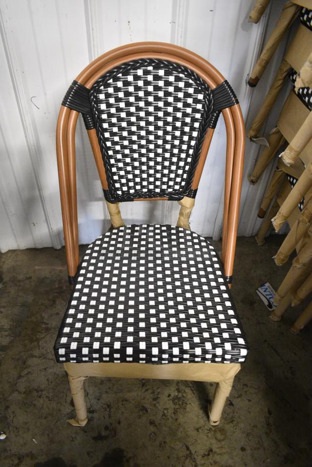 26 BRAND NEW SCRATCH AND DENT! Lancaster Table & Seating 427CSRTBSBKW  Bistro Series Black and White Checkered Weave Rattan Outdoor Side Chair. 26 Times Your Bid! - Image 1 of 8