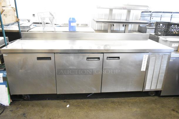 Delfield Stainless Steel Commercial Prep Table on Commercial Casters. 115 Volts, 1 Phase. Tested and Powers On But Does Not Get Cold - Image 1 of 7