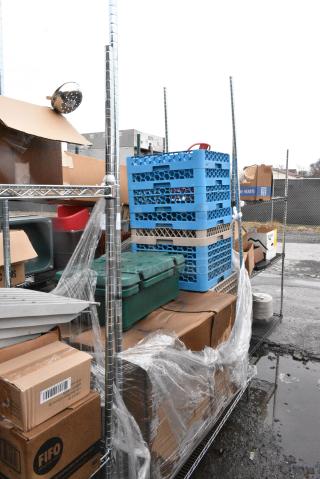 Chrome Finish 2 Tier Wire Shelving Unit w/ Contents Including Dish Caddies and Food Catering Case. BUYER MUST DISMANTLE. PCI CANNOT DISMANTLE FOR SHIPPING. PLEASE CONSIDER FREIGHT CHARGES.