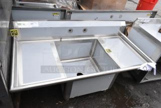 BRAND NEW SCRATCH AND DENT! Regency 600S12424218 72" 16 Gauge Stainless Steel One Compartment Commercial Sink with Stainless Steel Legs, Cross Bracing, and 2 Drainboards - 24" x 24" x 14" Bowl. No Legs.