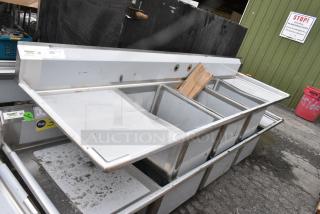 BRAND NEW SCRATCH AND DENT! Regency 600S31824224 16 Gauge Stainless Steel Three Compartment Commercial Sink with Galvanized Steel Legs and 2 Drainboards.